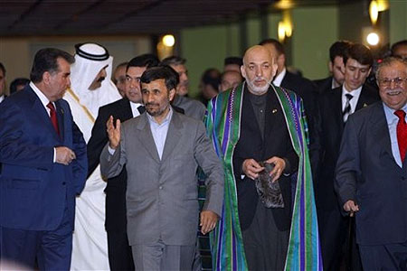 From left to right, Tajikistan President Emomali Rakhmon, Iranian President Mahmoud Ahmadinejad, Afghan President Hamid Karzai, and Iraqi President Jalal Talibani, arrive to attend in a summit of Economic Cooperation Organization (ECO) in Tehran, Iran on Wednesday March 11, 2009